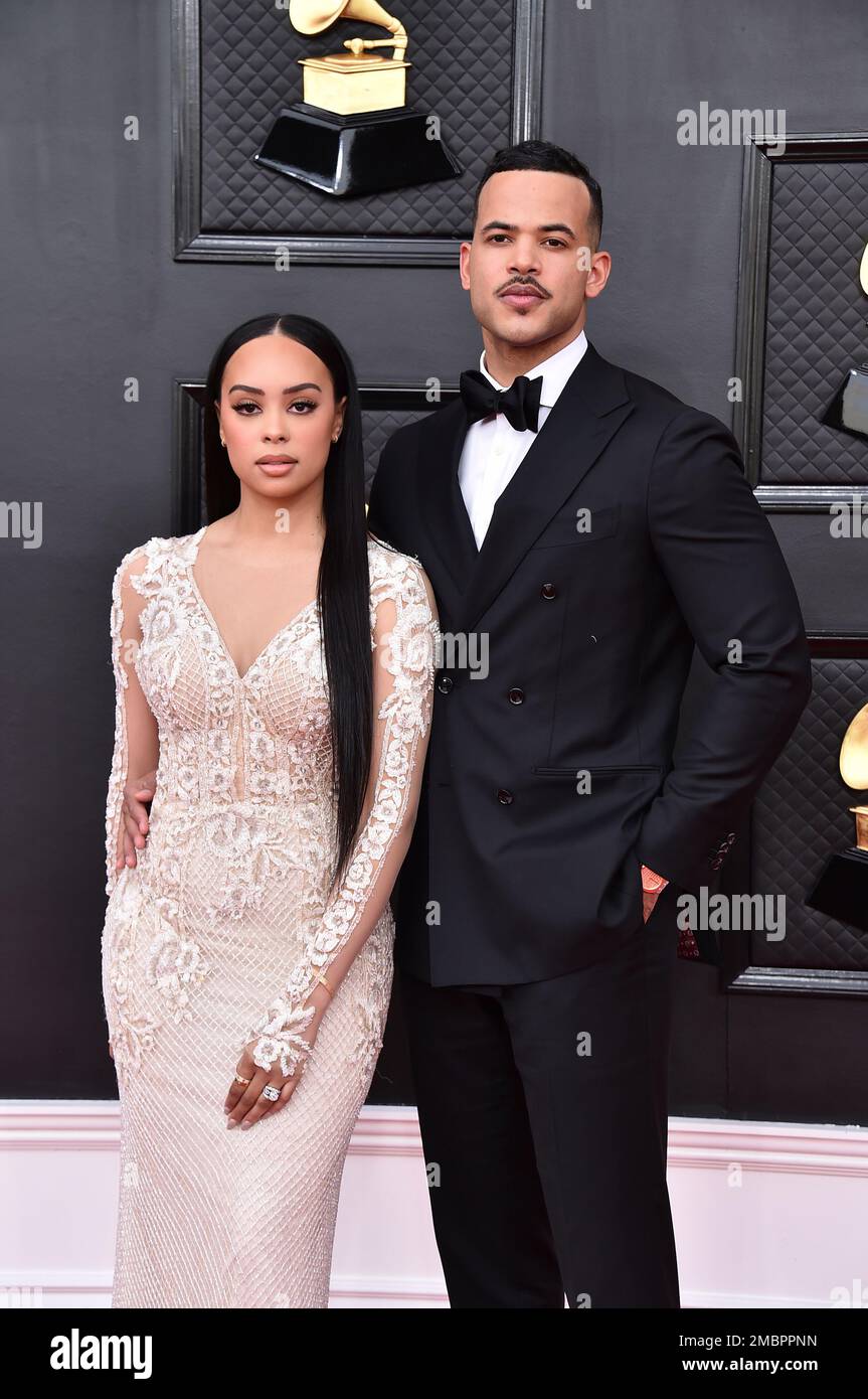 Kristy Sarah, left, and Desmond Scott arrive at the 64th Annual Grammy
