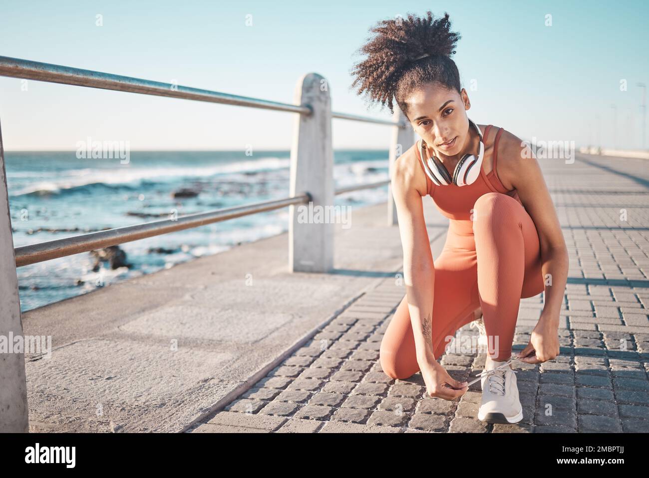 Portrait, exercise and black woman tie shoes, promenade and fitness for energy, wellness and training. African American female, lady and runner tying Stock Photo
