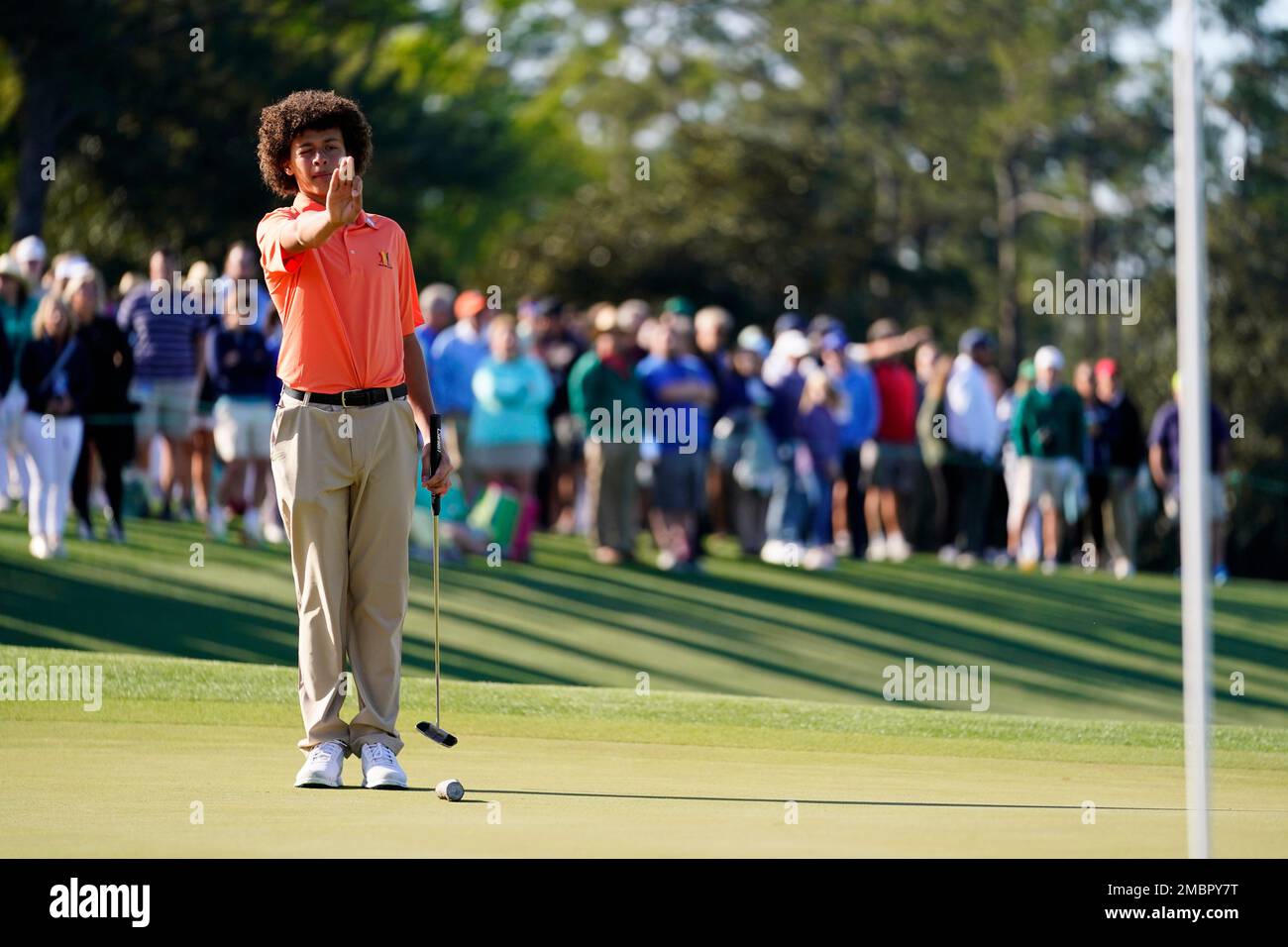 Lucky Cruz, of Magnolia, Texas, eyes a putt while competing in the Boys