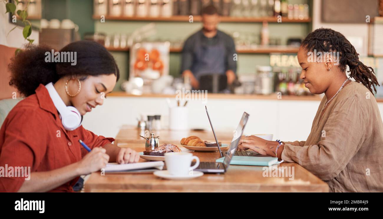 Students writing, studying on laptop in cafe for elearning, university education or working remote. Black women, friends and college research in Stock Photo