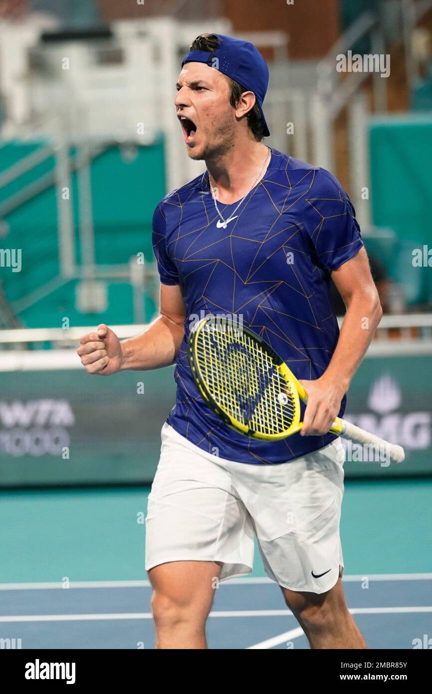 Miomir Kecmanovic of Serbia reacts to a point against Carlos Alcaraz of Spain during the Miami Open tennis tournament, Thursday, March 31, 2022, in Miami Gardens, Fla