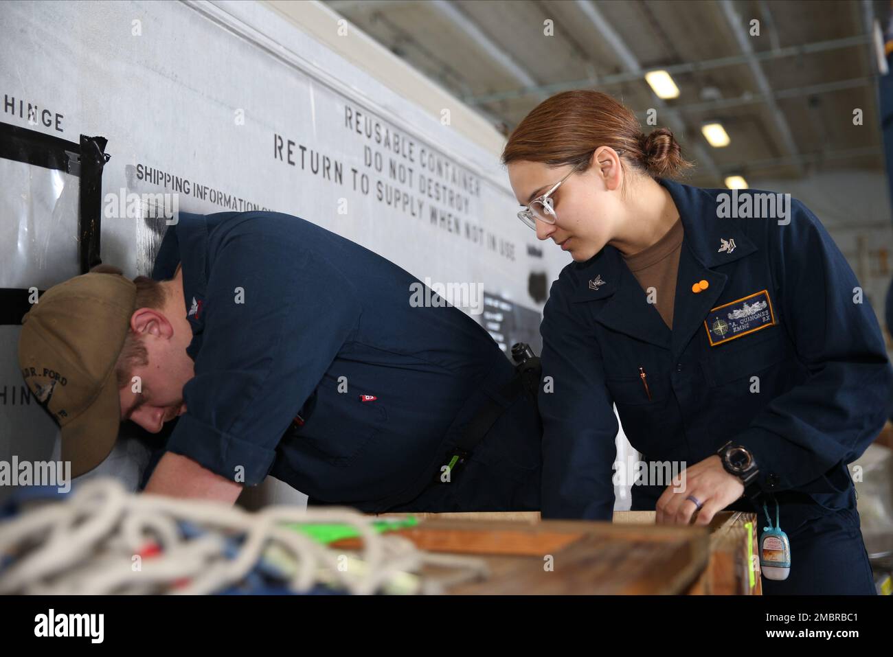 Electrician's Mate (Nuclear) 1st Class Bradley Burrets, left, from Cincinnati, and Electrician's