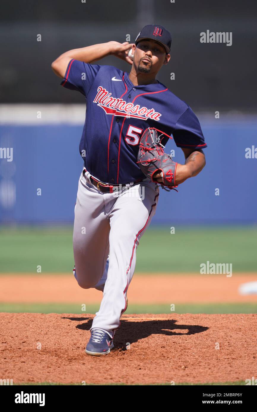 Minnesota Twins pitcher Jhoan Duran (59) delivers a pitch in the eighth  inning during a spring training baseball game against the Tampa Bay Rays at  the Charlotte Sports Park Tuesday March 29