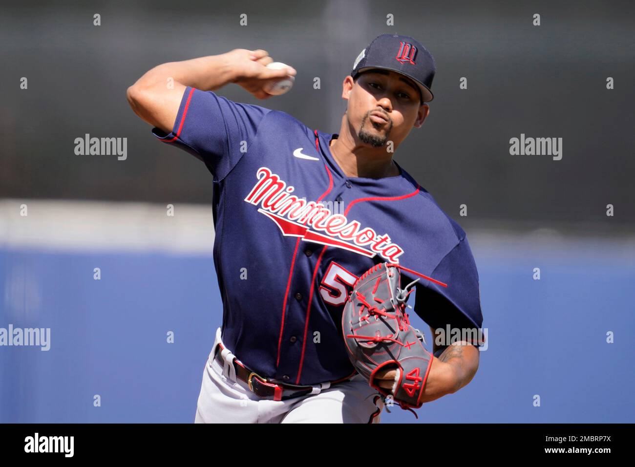 Minnesota Twins pitcher Jhoan Duran (59) delivers a pitch in the eighth  inning during a spring training baseball game against the Tampa Bay Rays at  the Charlotte Sports Park Tuesday March 29