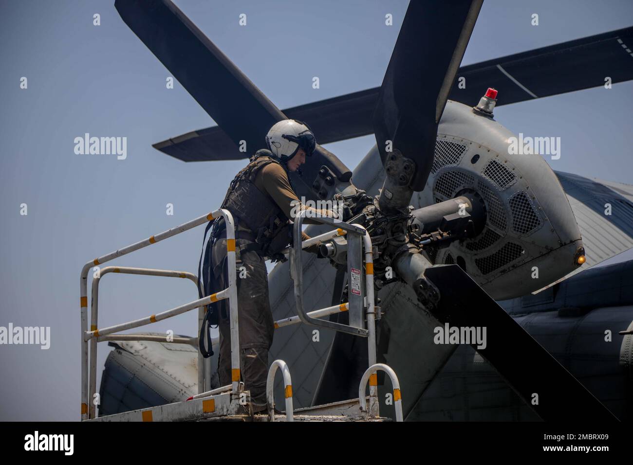 220621-A-EQ028-1103 ARABIAN GULF (June 21, 2022) Aviation Warfare Systems 2nd Class Brian Wall performs a preflight inspection on an MH-53 Sea Dragon helicopter attached to Helicopter Mine Countermeasures (HM) Squadron 15, aboard the expeditionary sea base USS Lewis B. Puller (ESB 3), during exercise Iron Defender in the Arabian Gulf, June 21. Iron Defender is an annual bilateral training event between U.S. Naval Forces Central Command and forces from the United Arab Emirates. The exercise focuses on maritime security operations, mine countermeasures, and harbor defense. Stock Photo
