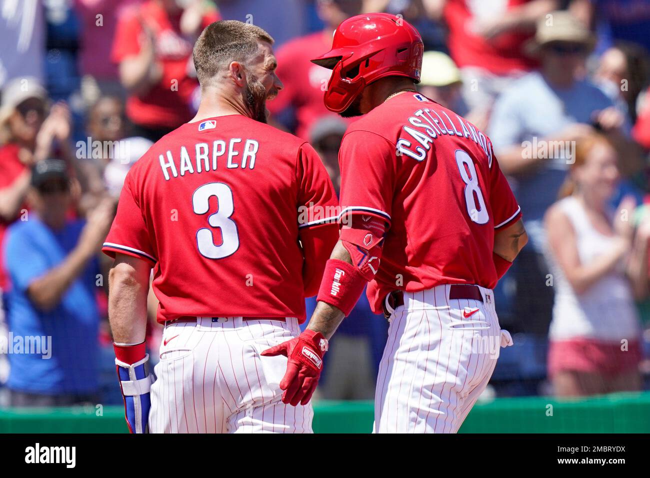 Philadelphia Phillies' Bryce Harper (3) reacts after Nick Castellanos (8)  hit a two-run home run during the first inning a spring training baseball  game against the Baltimore Orioles, Monday, March 28, 2022