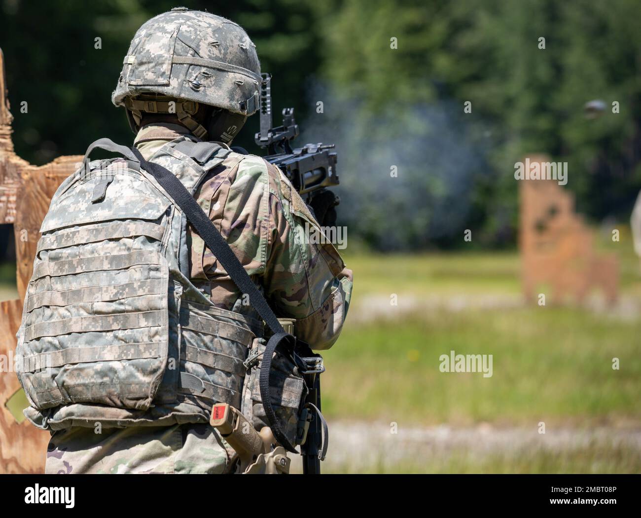 U.S. Army Cpl. Erik Saldana, an aircraft pneudraulics repairer with the 7th Infantry Division, I Corps, fires a grenade launcher at a target during a 3-gun marksmanship competition for the I Corps Best Squad Competition, June 21, 2022, at Joint Base Lewis-McChord, Washington. Eleven squads competed over five competition days in events including marksmanship, fitness tests, field exercises, obstacle courses, a ruck march and a review board. Stock Photo