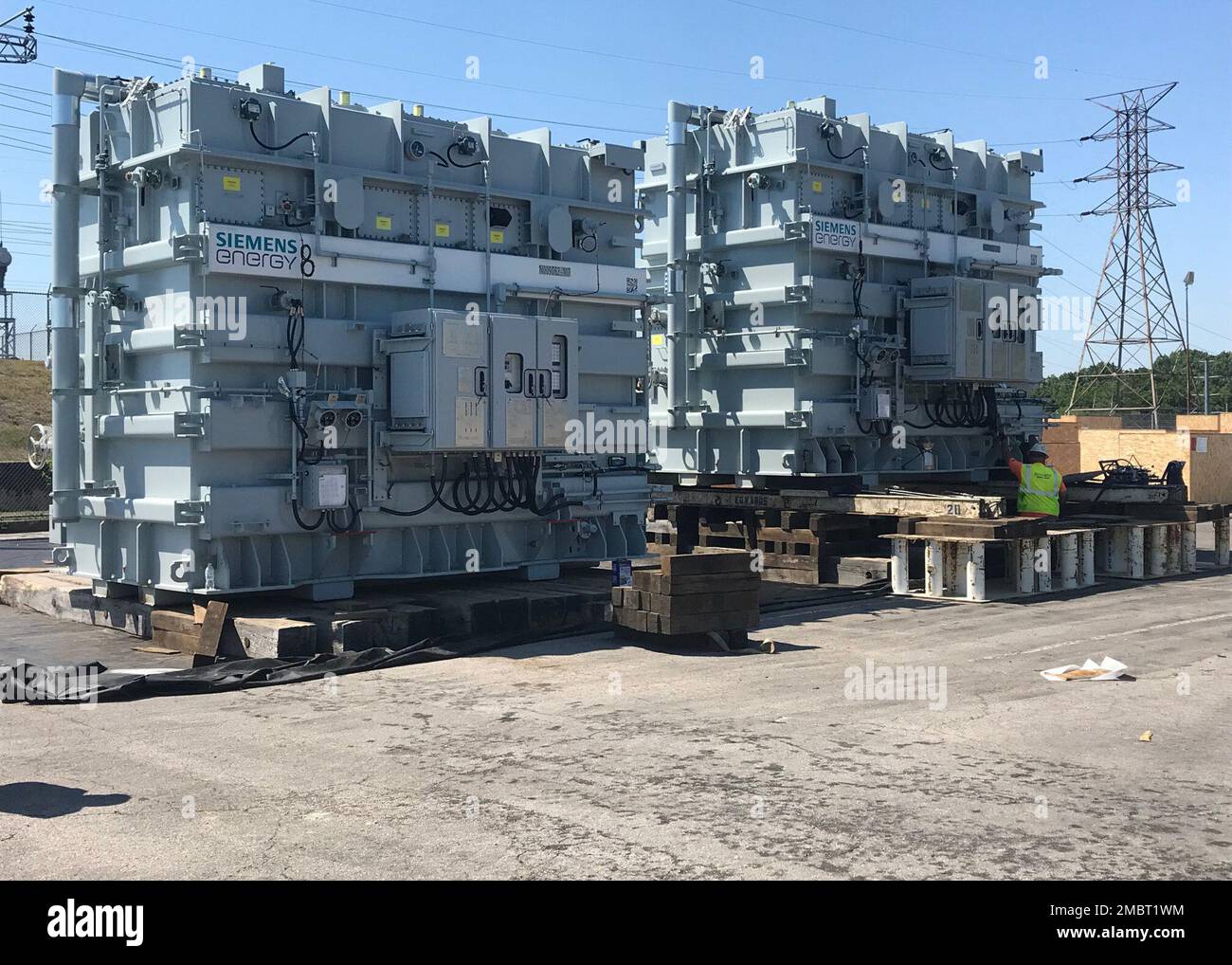 An engineer looks over the newly delivered Generator Stepup Unit