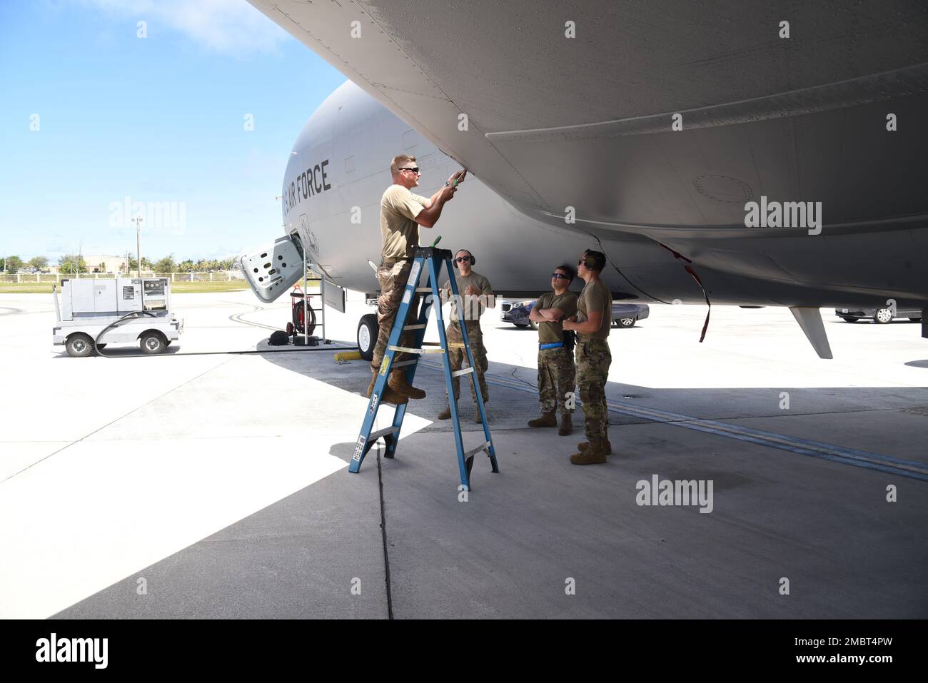 Aircraft maintainers with the New Jersey Air National Guard, replace a light bulb on a KC-135R at Andersen Air Force Base, Guam, on June 21, 2022. 108th Wing members have deployed to Guam to assist in flying operations. Stock Photo