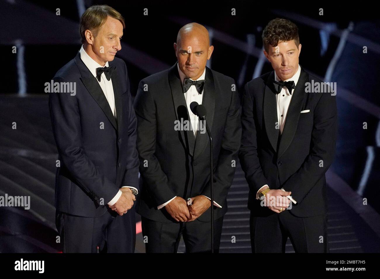Tony Hawk, from left, Kelly Slater and Shaun White present a Bond(02)