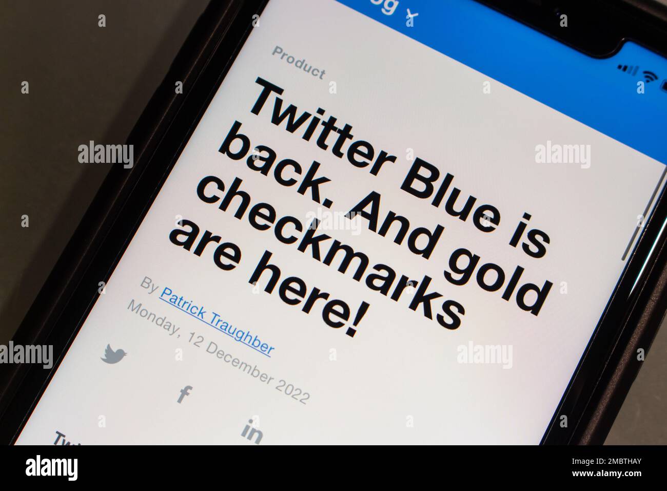 Vancouver, CANADA - Dec 18 2022 : A blog post about Twitter Blue and Twitter Gold from Twitter website seen in an iPhone. Stock Photo