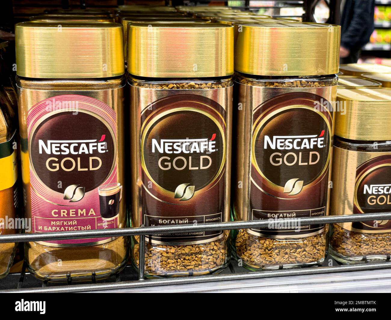 Anapa, Russia May 05, 2022:: Nescafe Gold granulated instant coffee, row of coffee glass jars on the shelves in the supermarket Stock Photo