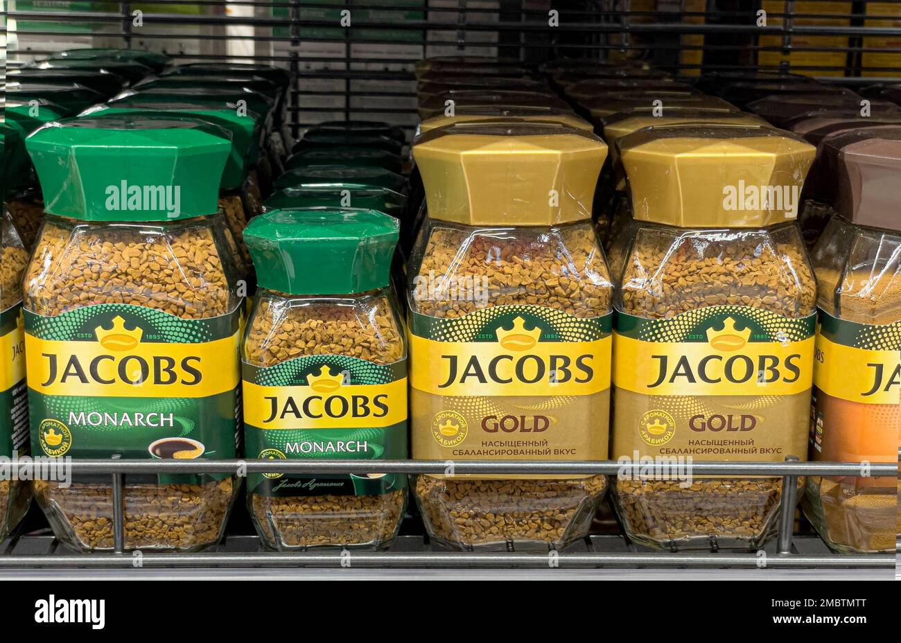 Anapa, Russia May 05, 2022:: Jacobs Monarch granulated instant coffee, row of coffee glass jars on the shelves in the supermarket Stock Photo