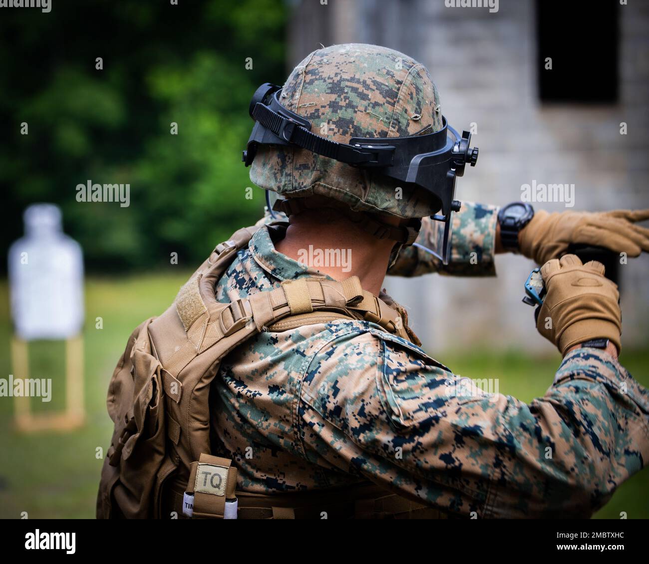 A Marine with Guard Company, Marine Barracks Washington, aims for a