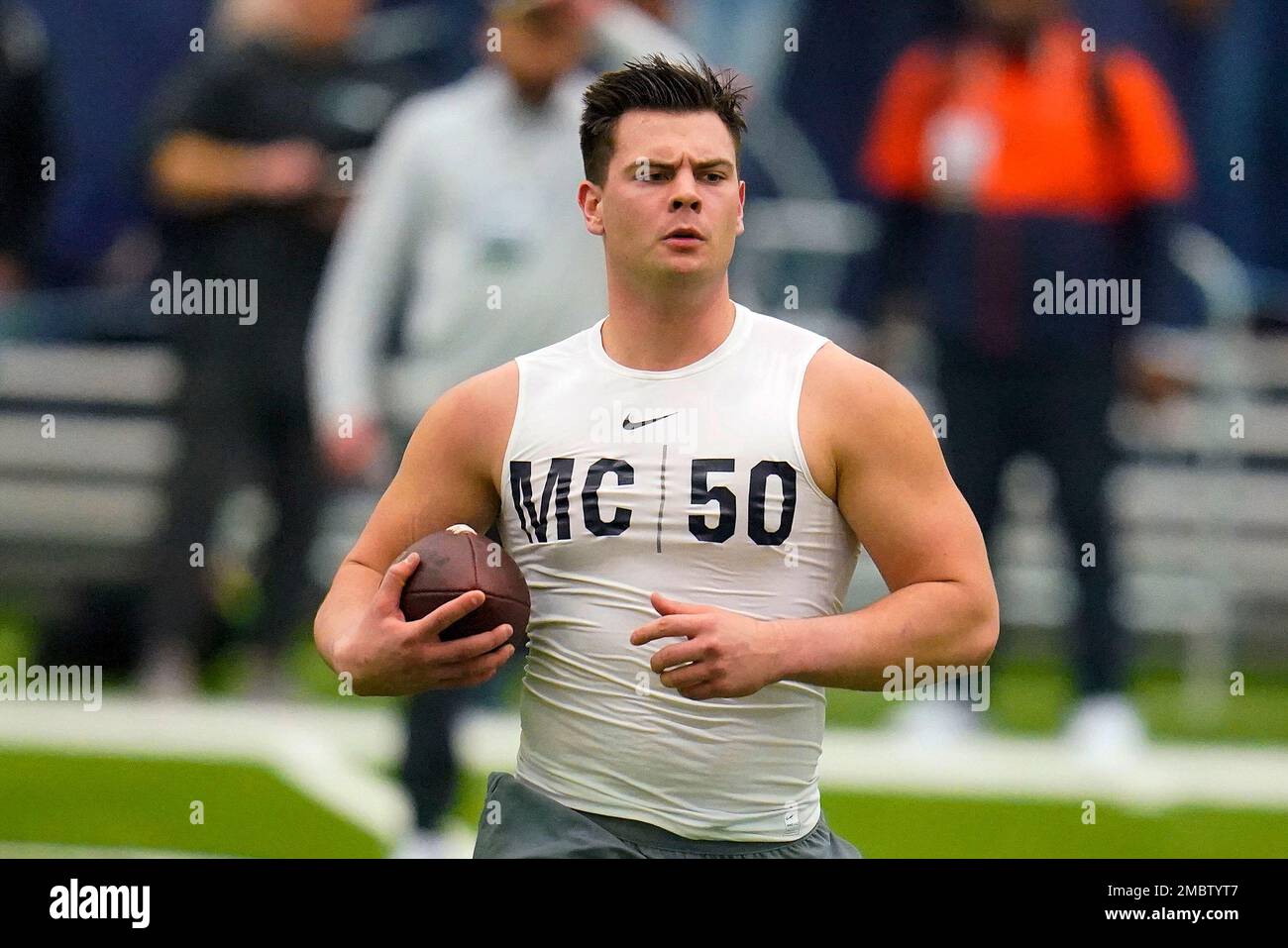Penn State linebacker Max Chizmar (50) runs a football drill during