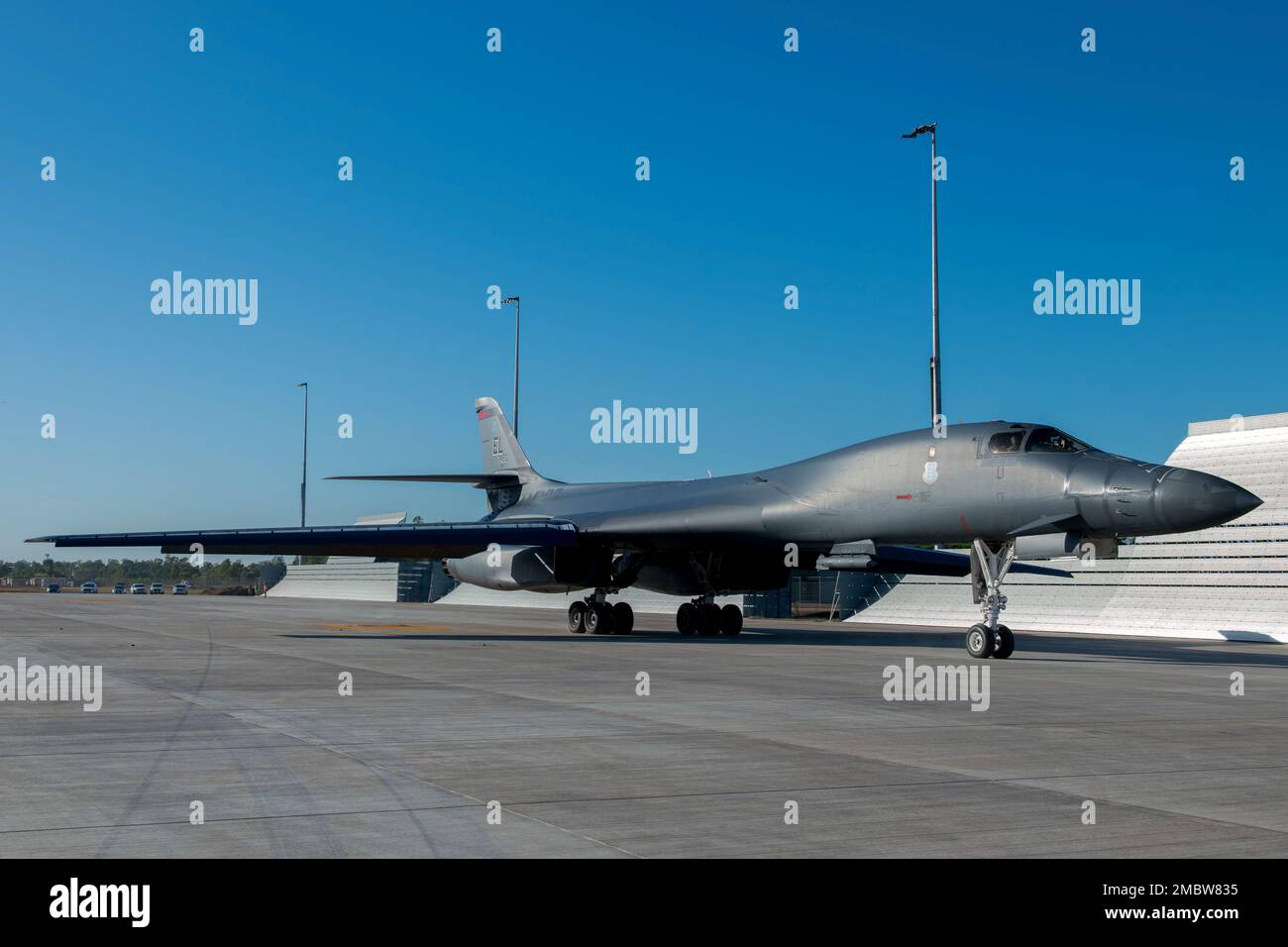A U.S. Air Force B-1B Lancer attached to the 34th Bomb Squadron, Ellsworth, South Dakota, taxies down the flightline of the Darwin Airport after landing at the Royal Australian Air Force Base, Darwin, NT, Australia, June 22, 2022. Bomber Task Force missions strengthen the collective ability of the U.S. and our allies and partners to maintain a free and open Indo-Pacific. Stock Photo
