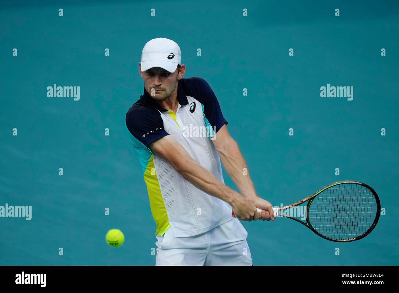 David Goffin of Belgium returns a ball in his first round mens match against Roberto Carballes Baena of Spain, at the Miami Open tennis tournament, Wednesday, March 23, 2022, in Miami Gardens,