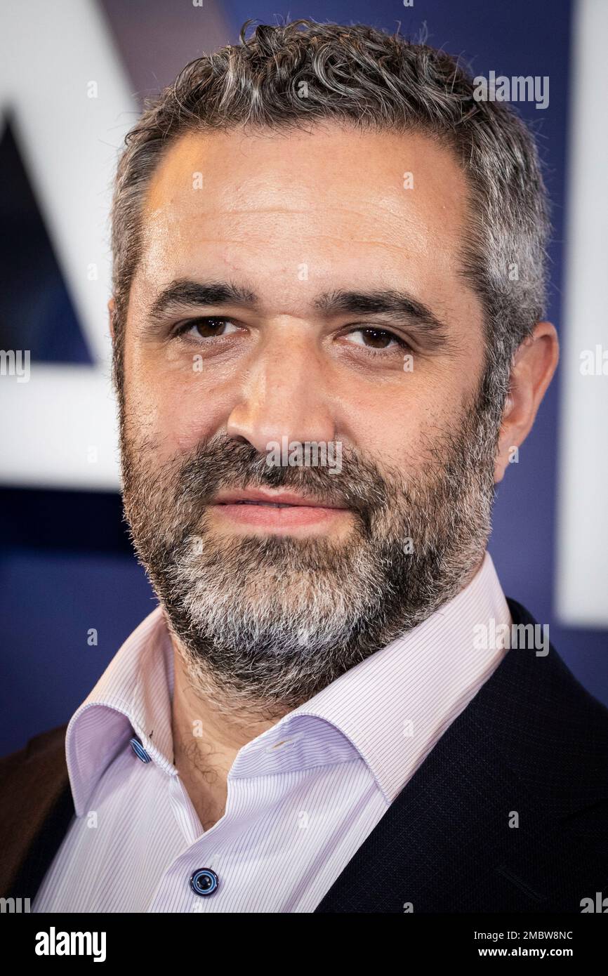 Bradley J. Fischer poses for photographers upon arrival at the premiere