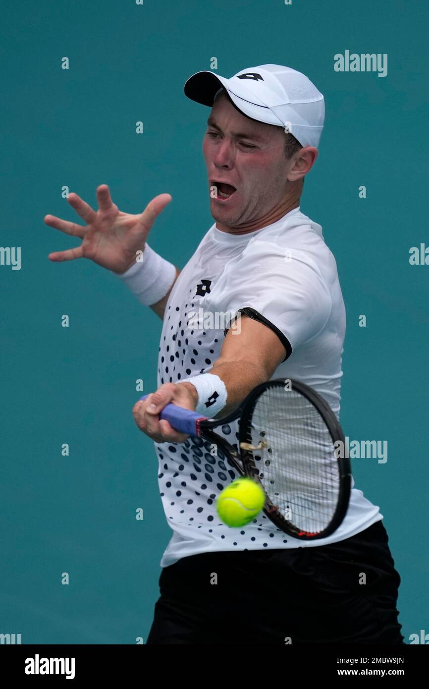 Dominik Koepfer of Germany returns a ball in his first round men's match  against Mackenzie McDonald of the U.S., at the Miami Open tennis  tournament, Wednesday, March 23, 2022, in Miami Gardens,