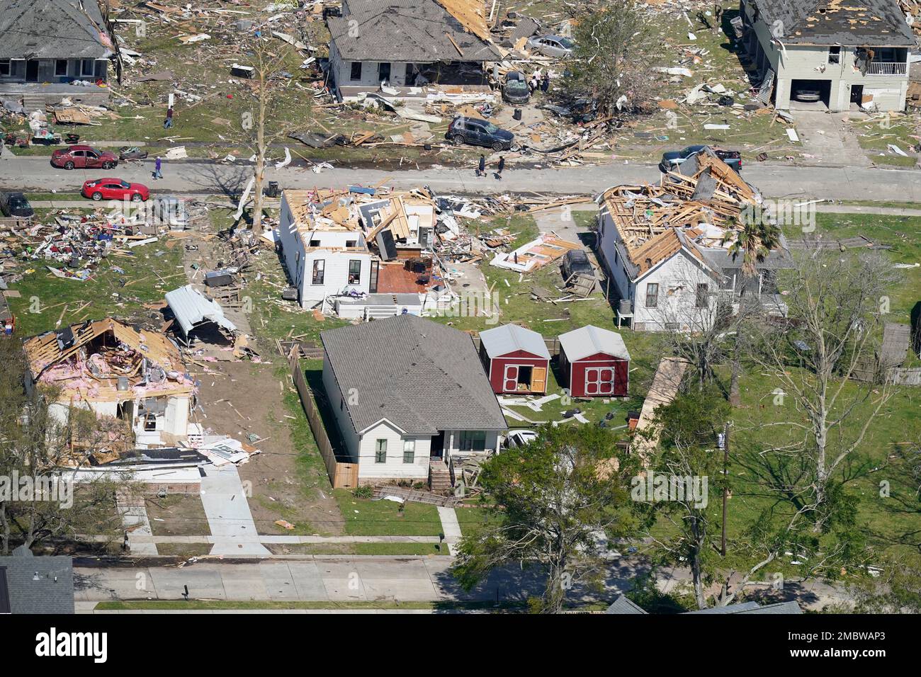 Homes are damaged after a tornado swept through, Wednesday, March 23