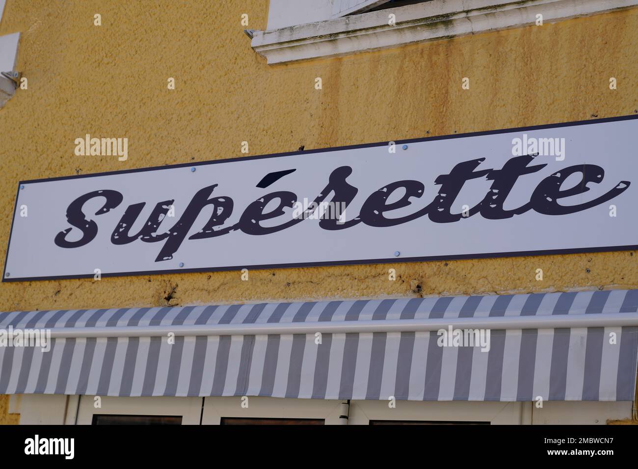 superette french text means convenience store board advertising shop