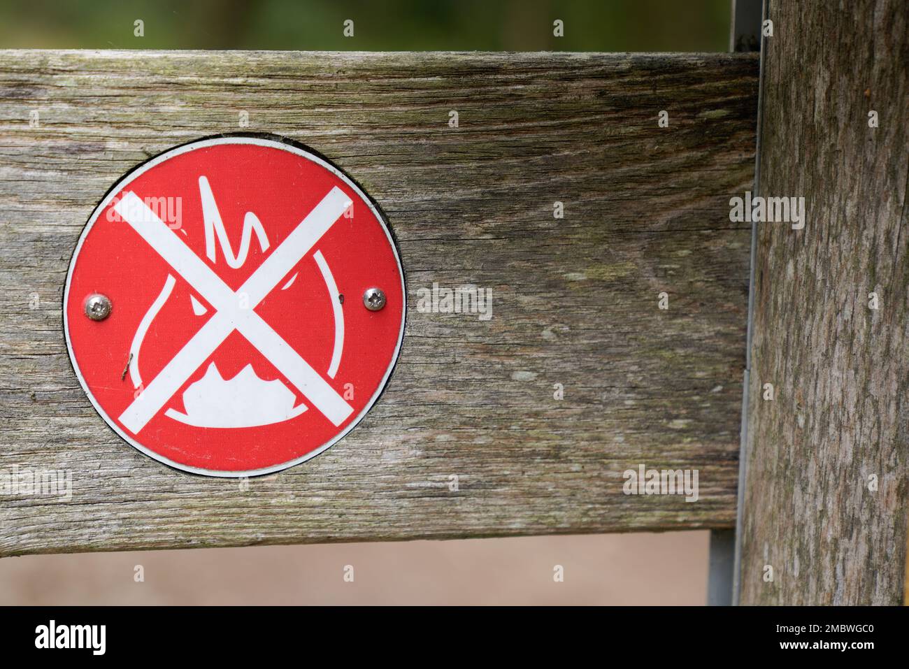 No open fire burning symbol text in wooden panel outdoor park with