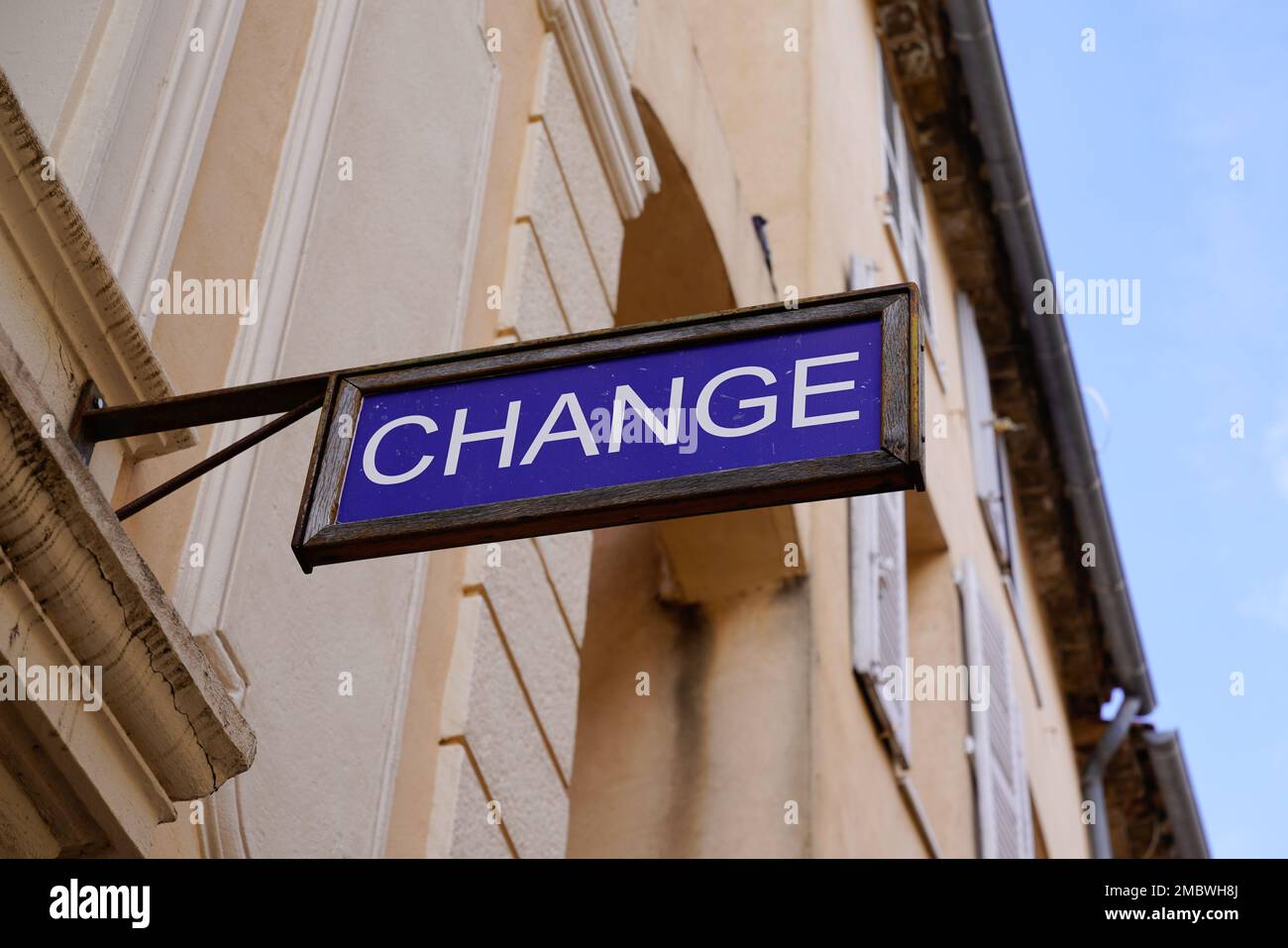change means in french text exchange money office sign in wall building