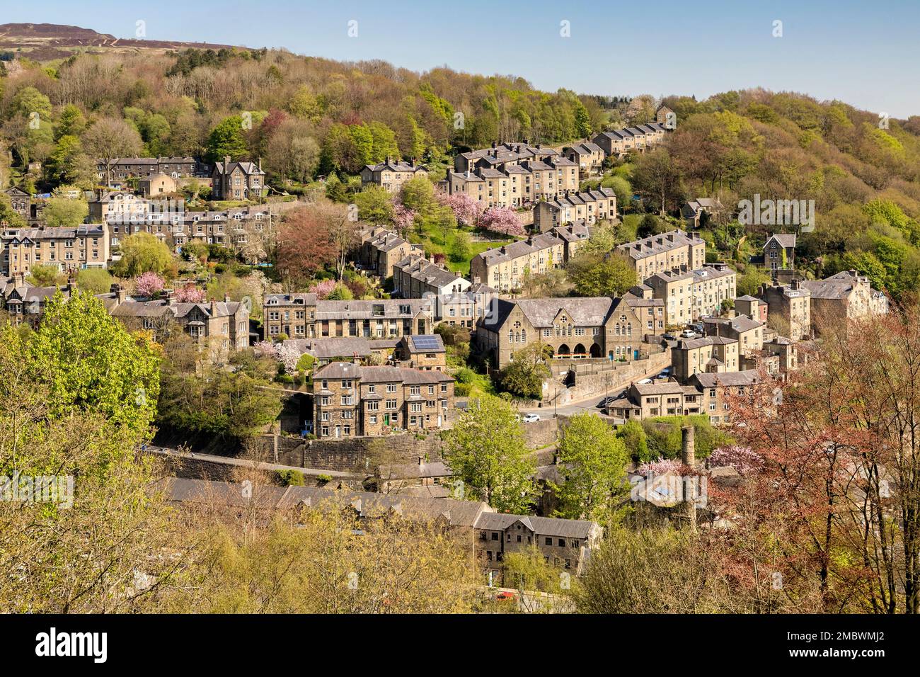 29 April 2022: Hebden Bridge, West Yorkshire, UK - Sunny day in spring, with a view over the terraced houses of the beautiful old mill town. Lush and Stock Photo