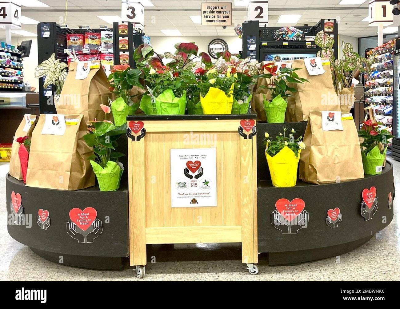 Pictured here are prepackaged Feds Feed Families donation bags at the Naval Station Great Lakes Commissary in Illinois. The bags are available for stateside patrons and employees to purchase for $15 or less. (DeCA photo: Christine Davinich, Great Lakes) Stock Photo