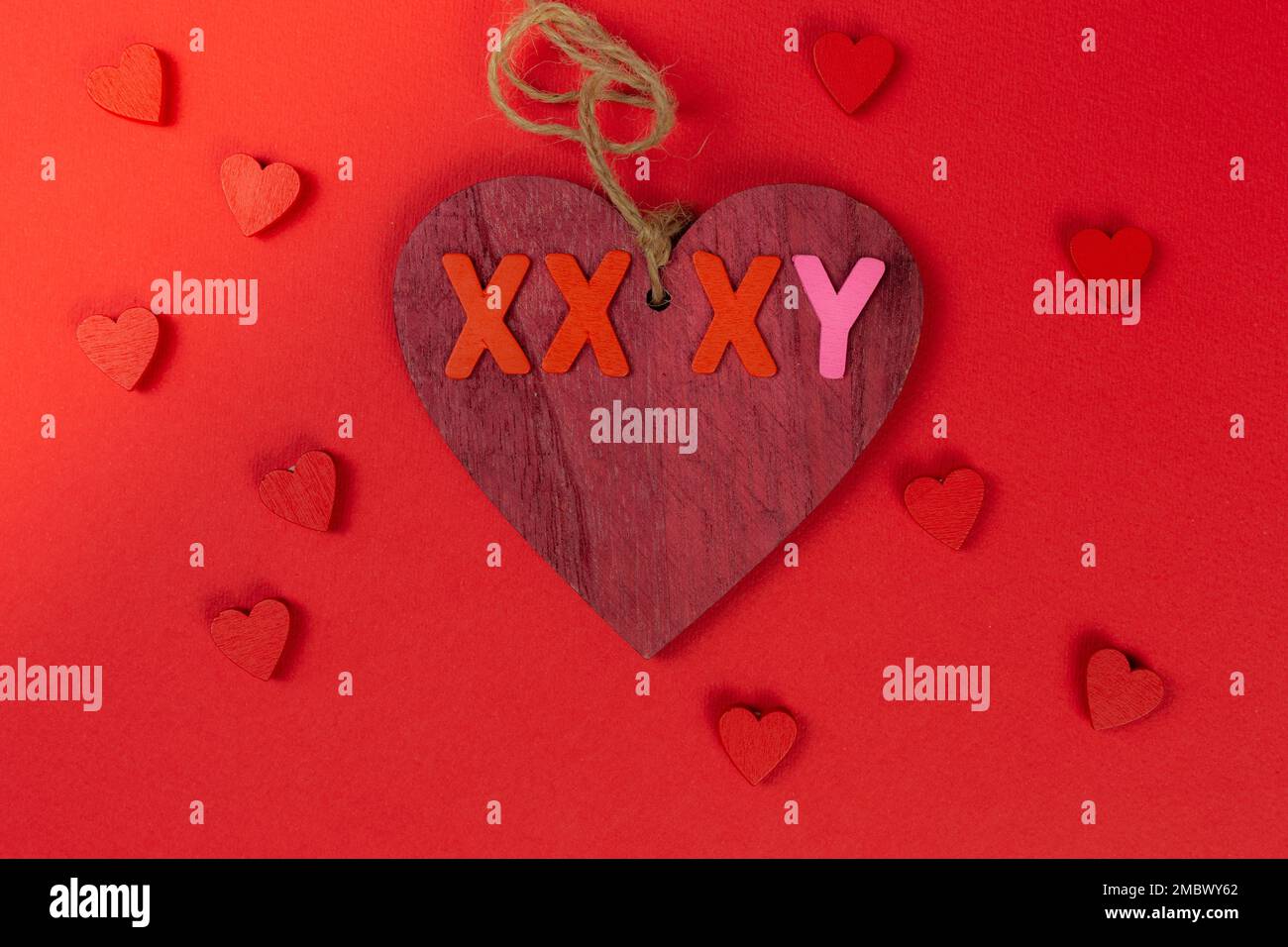 valentines day red heart made of wood on a red background with little ...