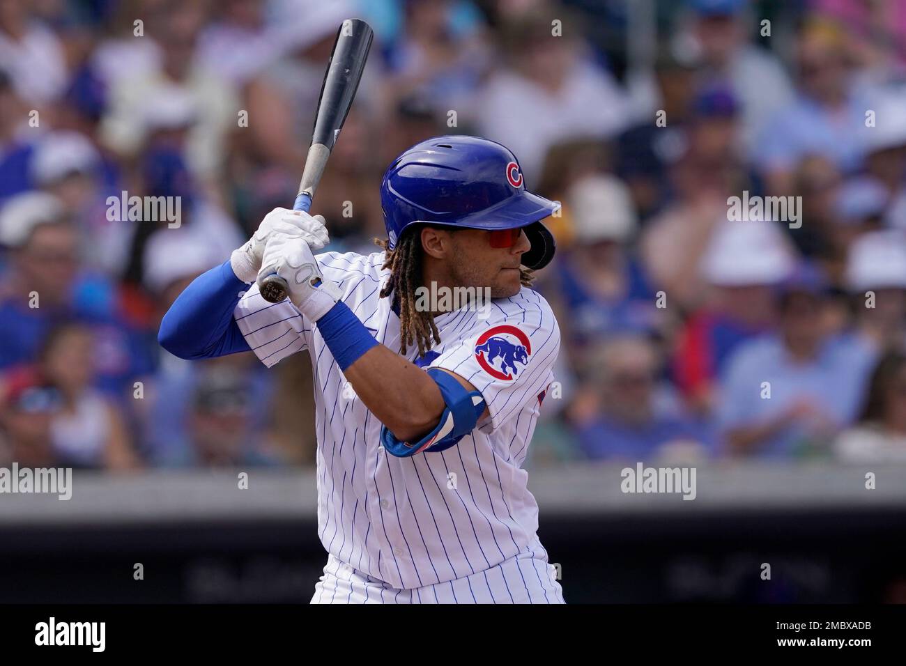 PEORIA, AZ - MARCH 26: Chicago Cubs outfielder Michael Hermosillo (32)  reaches home safely during the MLB Spring Training baseball game between  the Chicago Cubs and the San Diego Padres on March