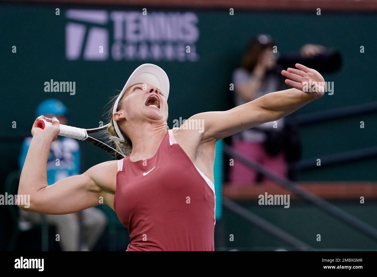 Simona Halep, of Romania, serves to Iga Swiatek, of Poland, during the womens singles semifinals at the BNP Paribas Open tennis tournament Friday, March 18, 2022, in Indian Wells, Calif