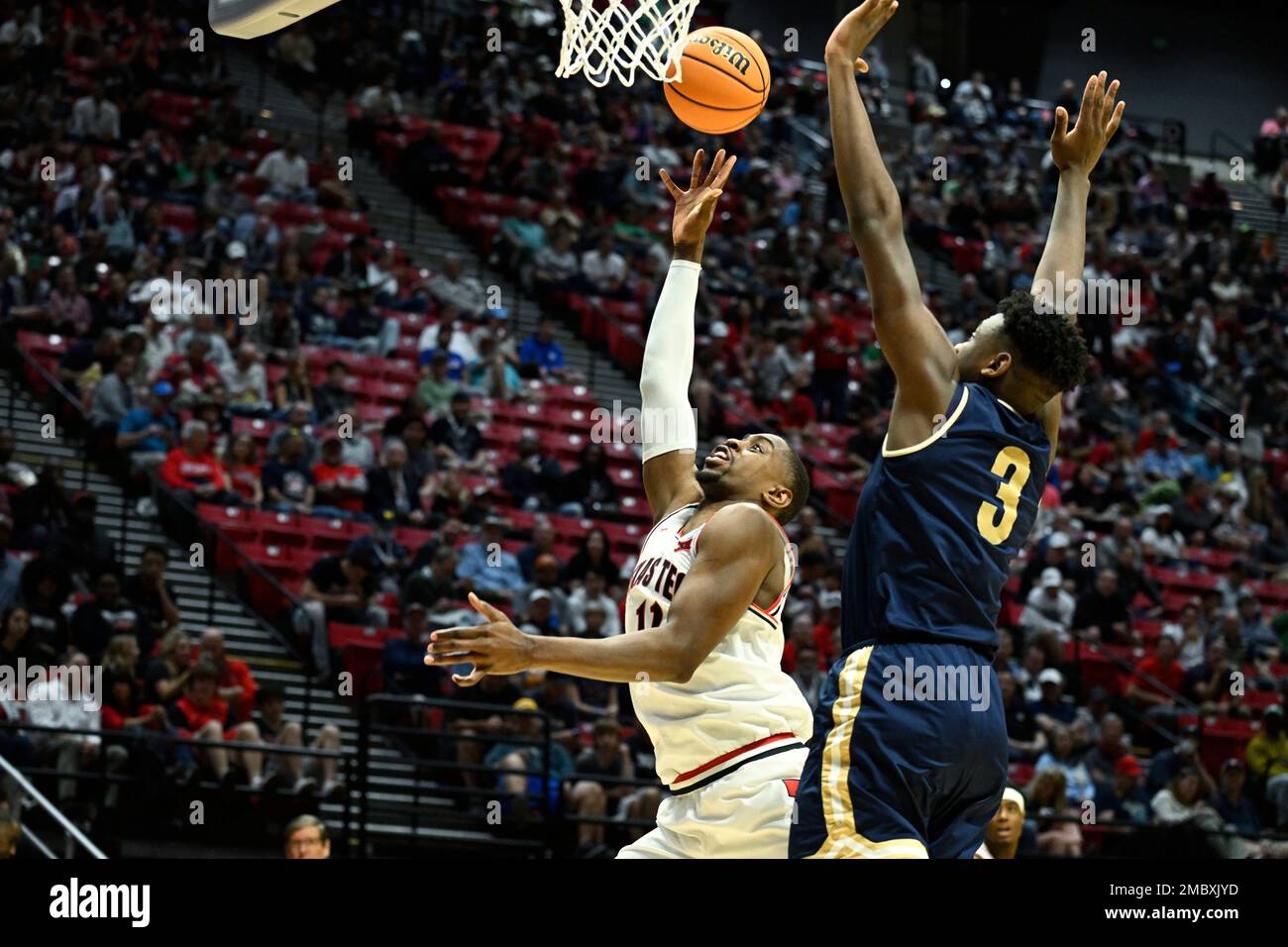 Texas Tech forward Bryson Williams, left, shoots in front of Montana