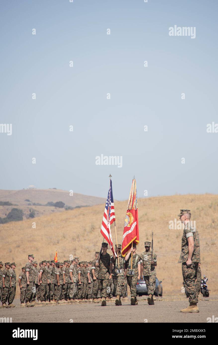 U.S. Marines with 1st Marine Regiment, 1st Marine Division color guard, march on the colors during a change of command ceremony at Marine Corps Base Camp Pendleton, California, June 23, 2022. During the ceremony, Col. Brandon Graham relinquished command of 1st Marine Regiment to Col. Brendan Sullivan. Stock Photo