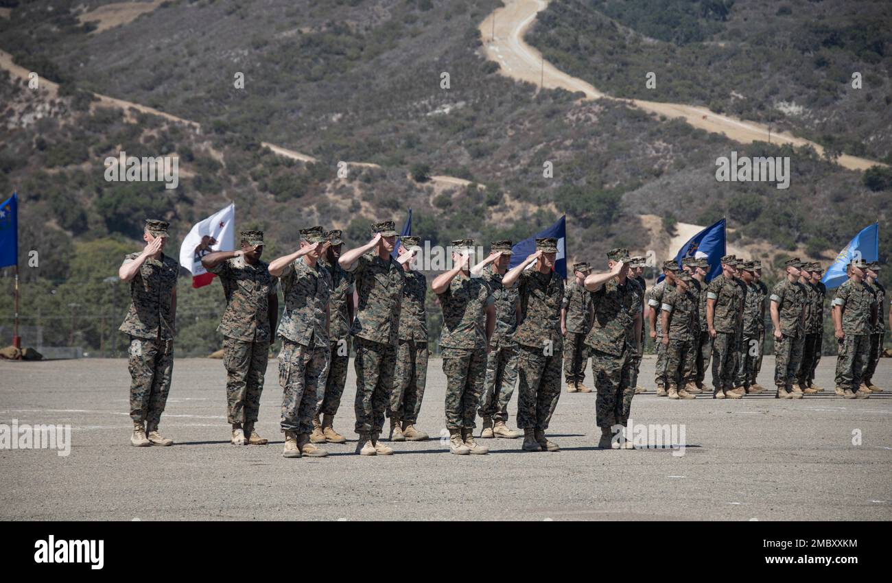 U.S. Marines with 1st Marine Regiment, 1st Marine Division, present arms during a change of command ceremony at Marine Corps Base Camp Pendleton, California, June 23, 2022. During the ceremony, Col. Brandon Graham relinquished command of 1st Marine Regiment to Col. Brendan Sullivan. Stock Photo