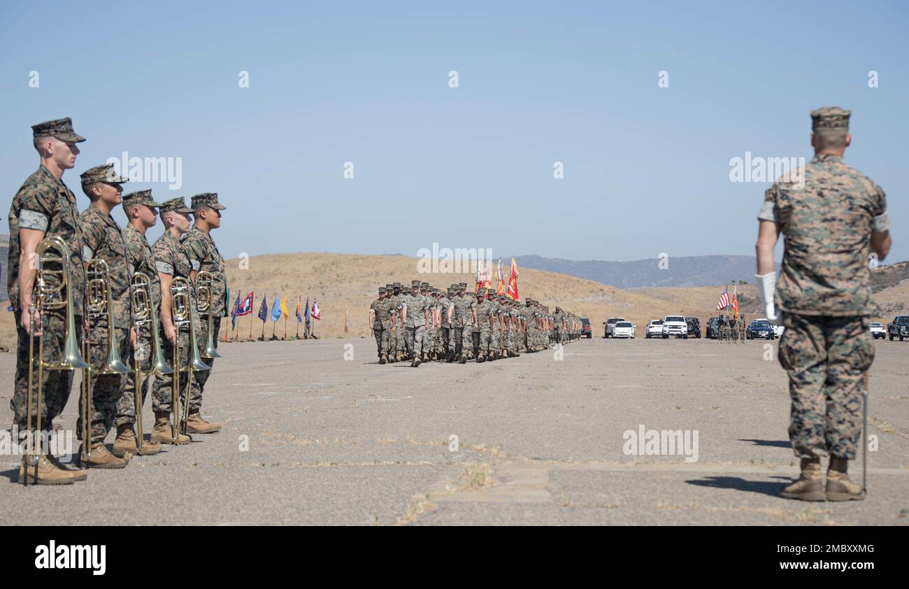 U.S. Marines with 1st Marine Regiment, 1st Marine Division, march on the parade deck during a change of command ceremony at Marine Corps Base Camp Pendleton, California, June 23, 2022. During the ceremony, Col. Brandon Graham relinquished command of 1st Marine Regiment to Col. Brendan Sullivan. Stock Photo