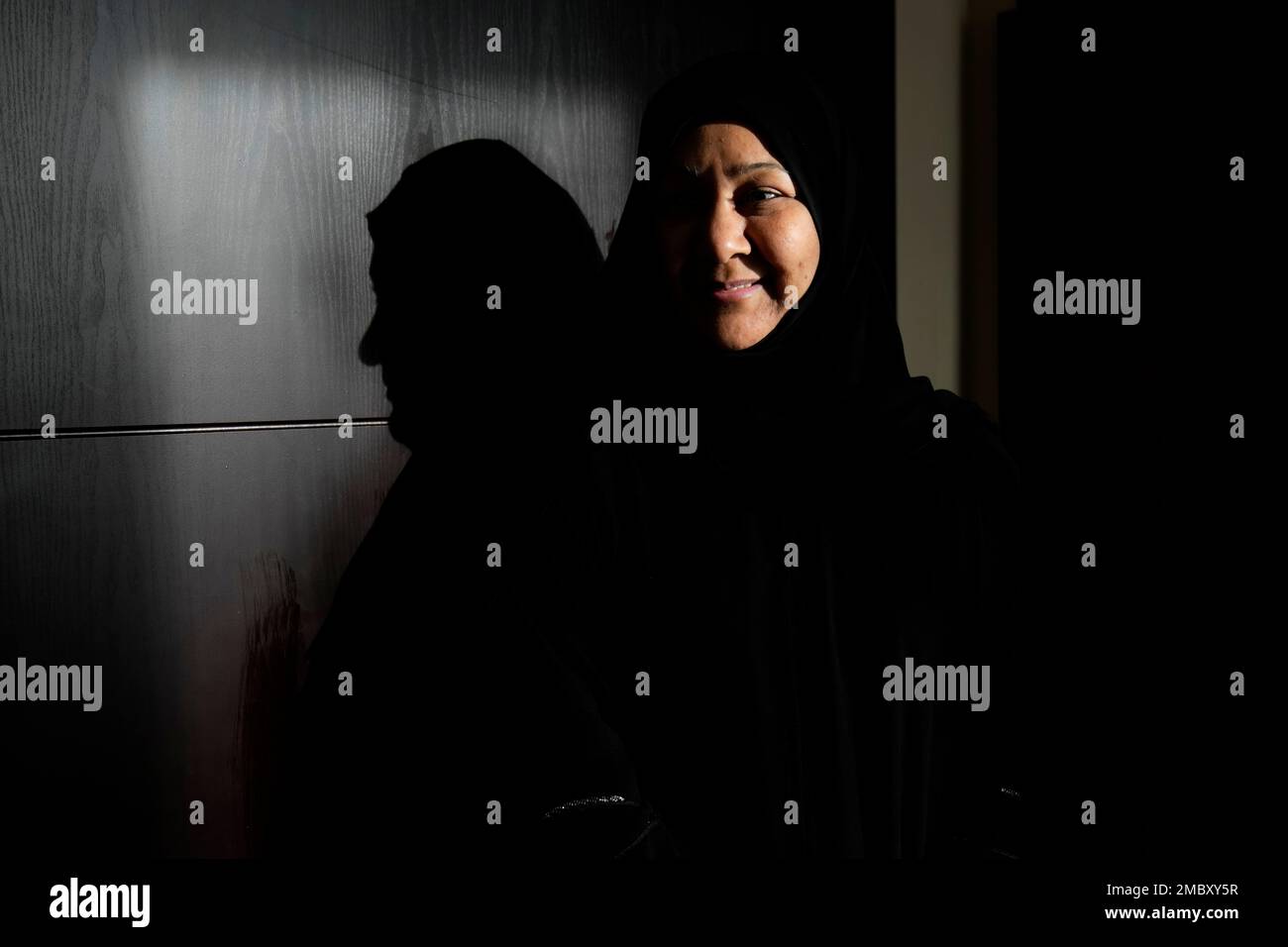 Bahraini former political prisoner Najah Yusuf poses for a photograph  during an interview with The Associated Press in Manama, Bahrain, Thursday,  March 17, 2022. As Formula One begins the new season in