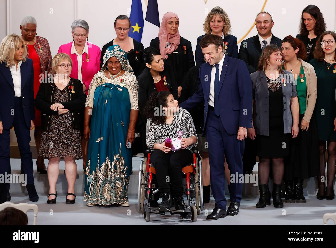 French President Emmanuel Macron and his wife Brigitte Macron, left