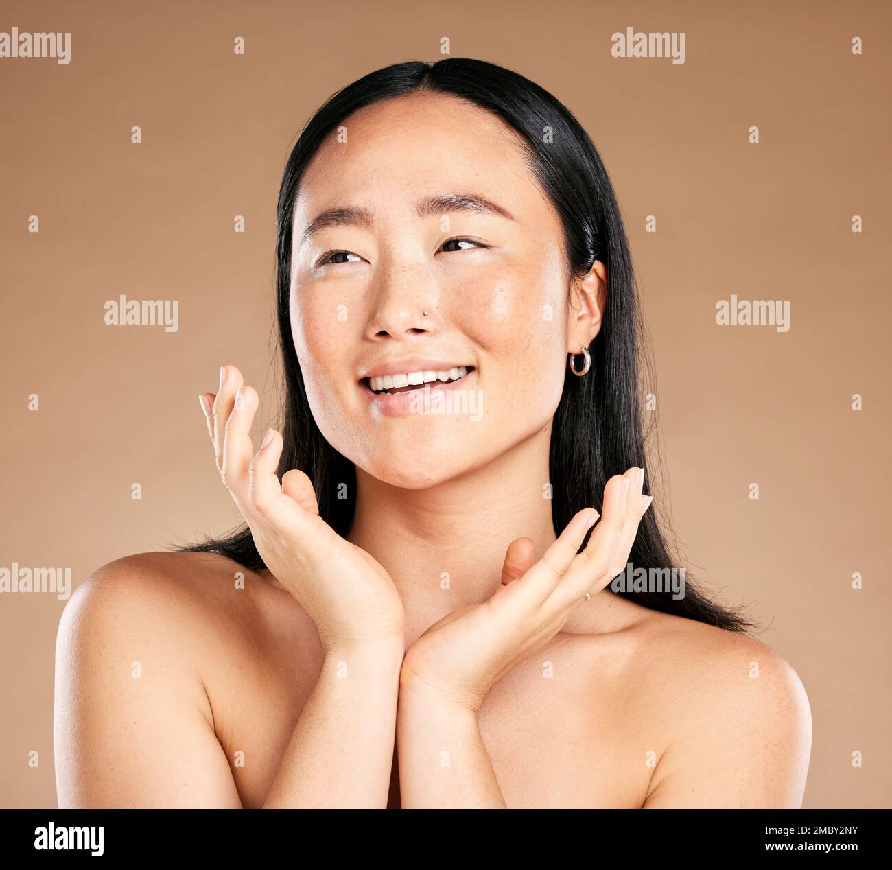 Beauty, skincare or happy Japanese woman cleaning face in grooming routine isolated on studio