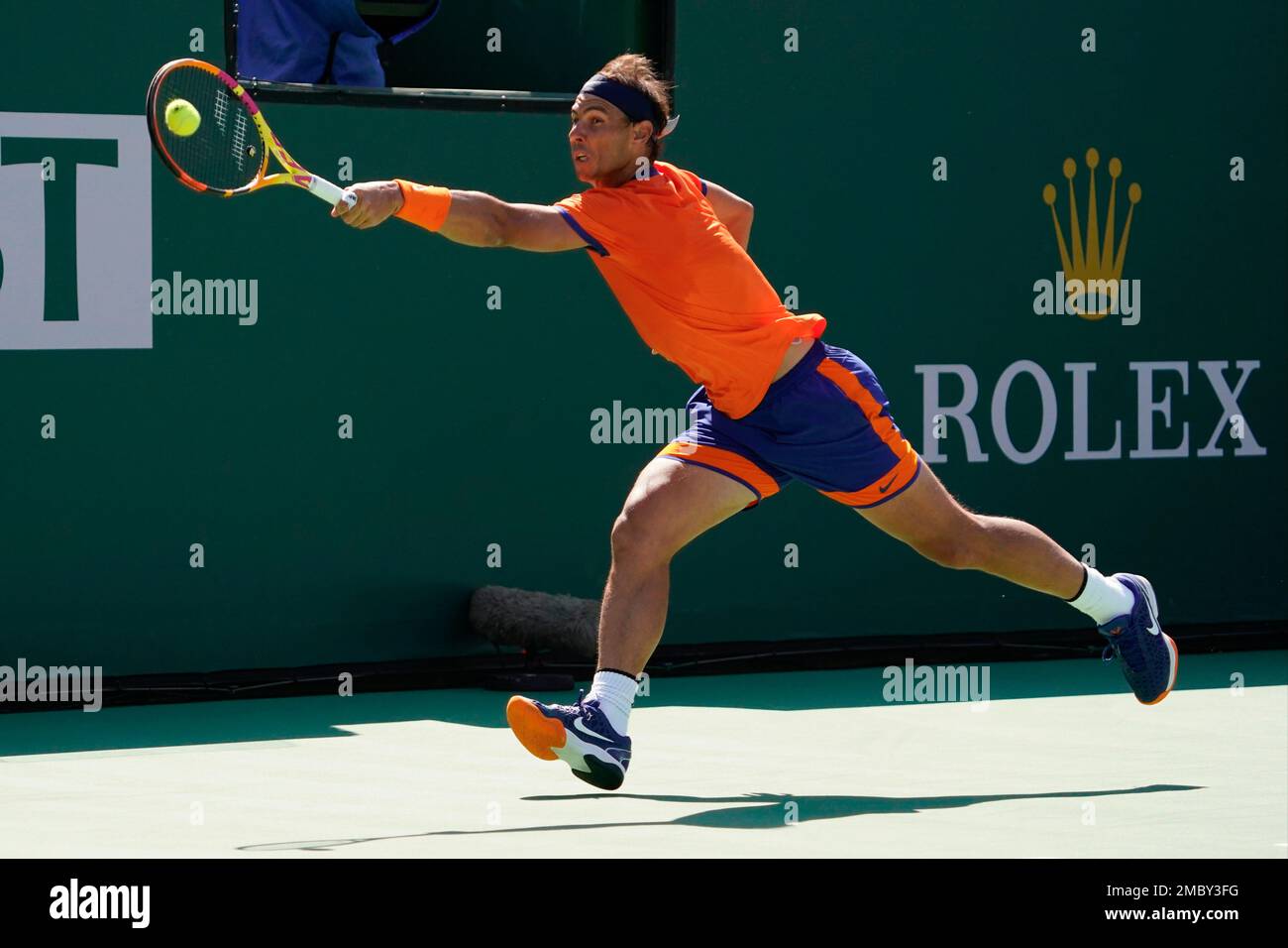 Rafael Nadal, of Spain, returns a shot to Reilly Opelka at the BNP Paribas Open tennis tournament Wednesday, March 16, 2022, in Indian Wells, Calif