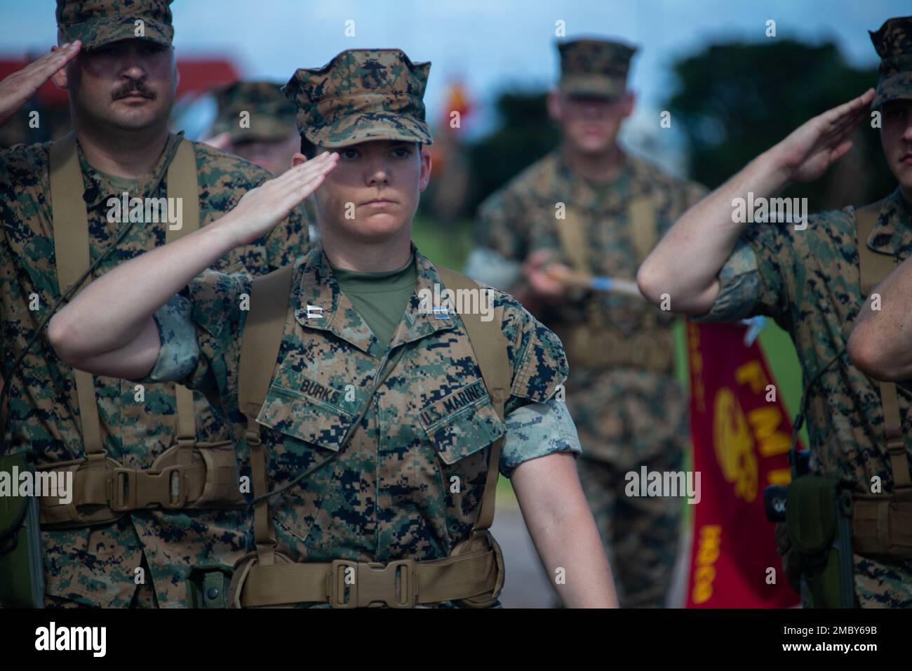 U.S. Marine Corps Capt. Valerie Burks, Combat Logistics Regiment 37 adjutant, salutes for pass in review during a change of command ceremony on Camp Kinser, Okinawa, Japan, June 24, 2022. During the ceremony, Brig. Gen. Brian Wolford, outgoing commanding general, relinquished command of 3rd MLG to Brig. Gen. Adam L. Chalkley. 3rd MLG, based out of Okinawa, Japan, is a forward deployed combat unit that serves as III Marine Expeditionary Force’s comprehensive logistics and combat service support backbone for operations throughout the Indo-Pacific area of responsibility. Stock Photo