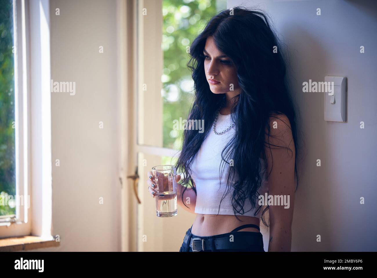 Mental health, depression and sad woman thinking with water, stress and