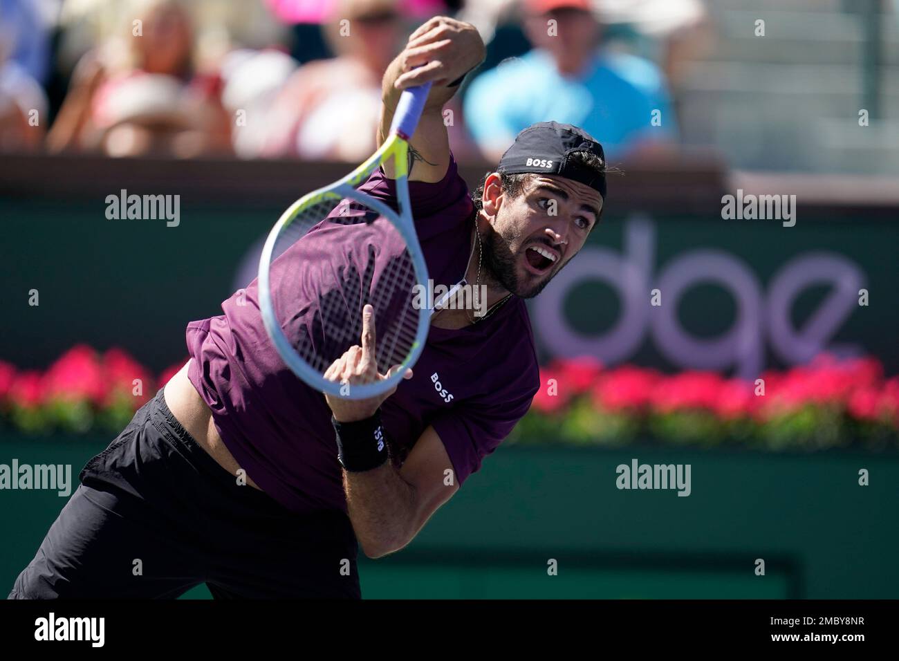 Matteo Berrettini, of Italy, serves to Lloyd Harris, of South Africa, at the BNP Paribas Open tennis tournament Tuesday, March 15, 2022, in Indian Wells, Calif