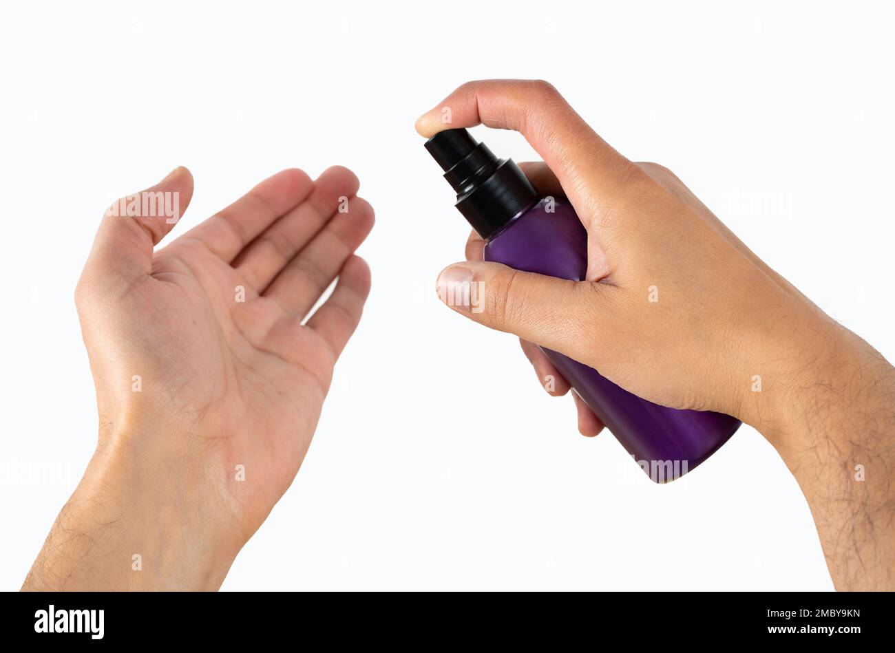 Cosmetic bottle, men’s hand using lotion, body care, skin care with white background Stock Photo