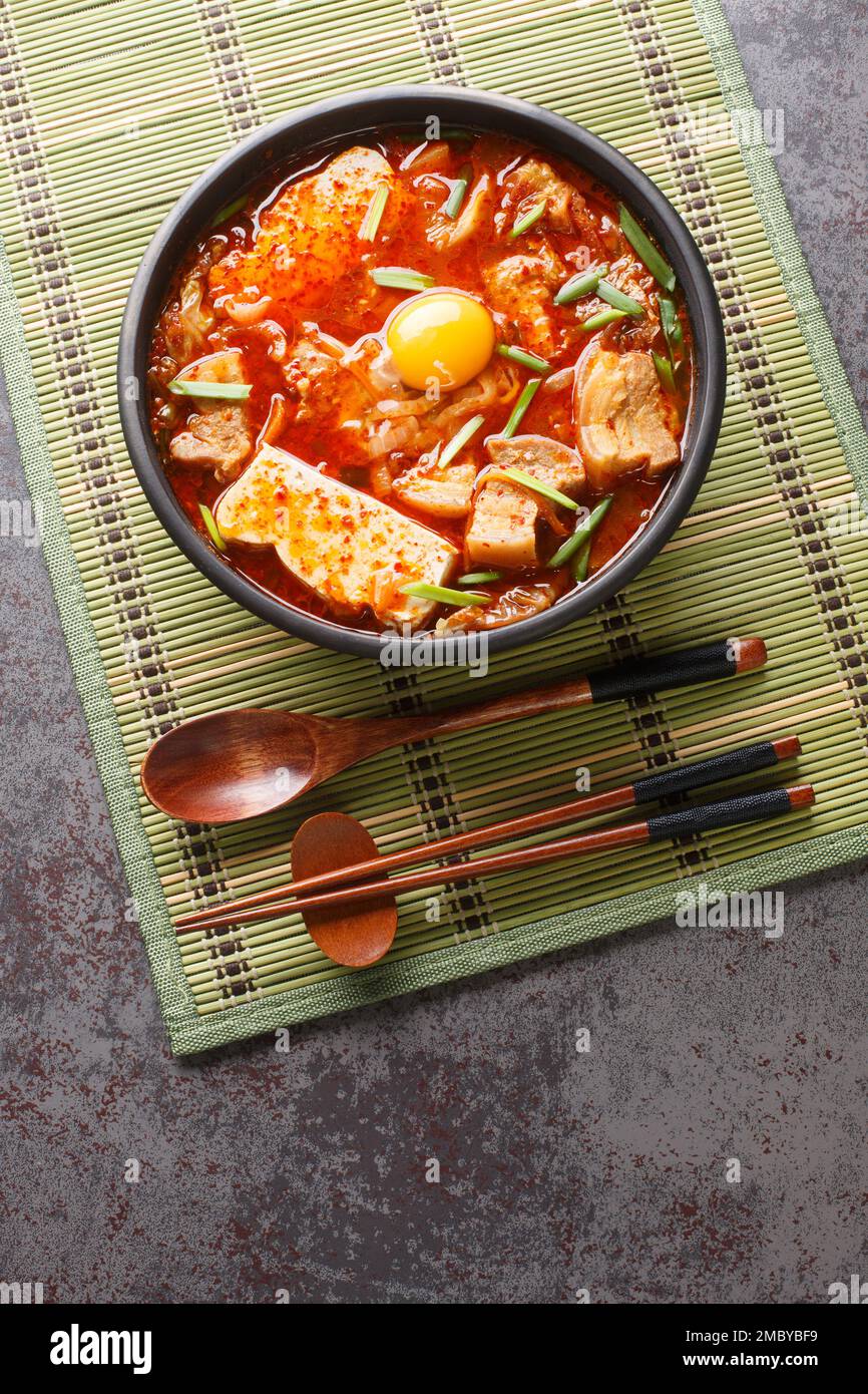 Sundubu jjigae is a Korean stew made with soft tofu, kimchi, pork belly