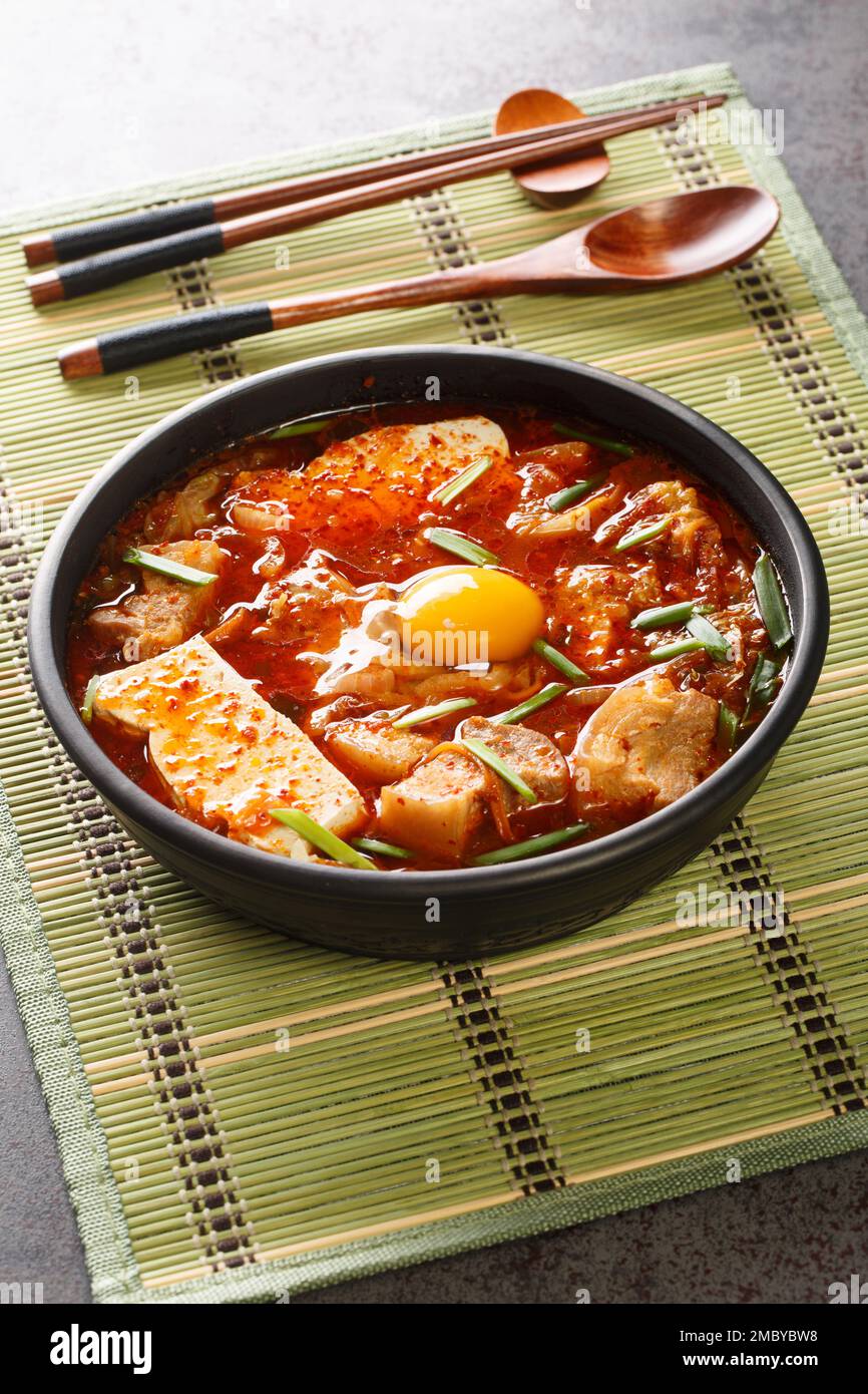 Sundubu jjigae is a Korean stew made with soft tofu, kimchi, pork belly