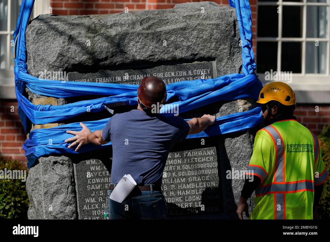 Crews remove the stone base of the Talbot Boys Statue, Maryland's last