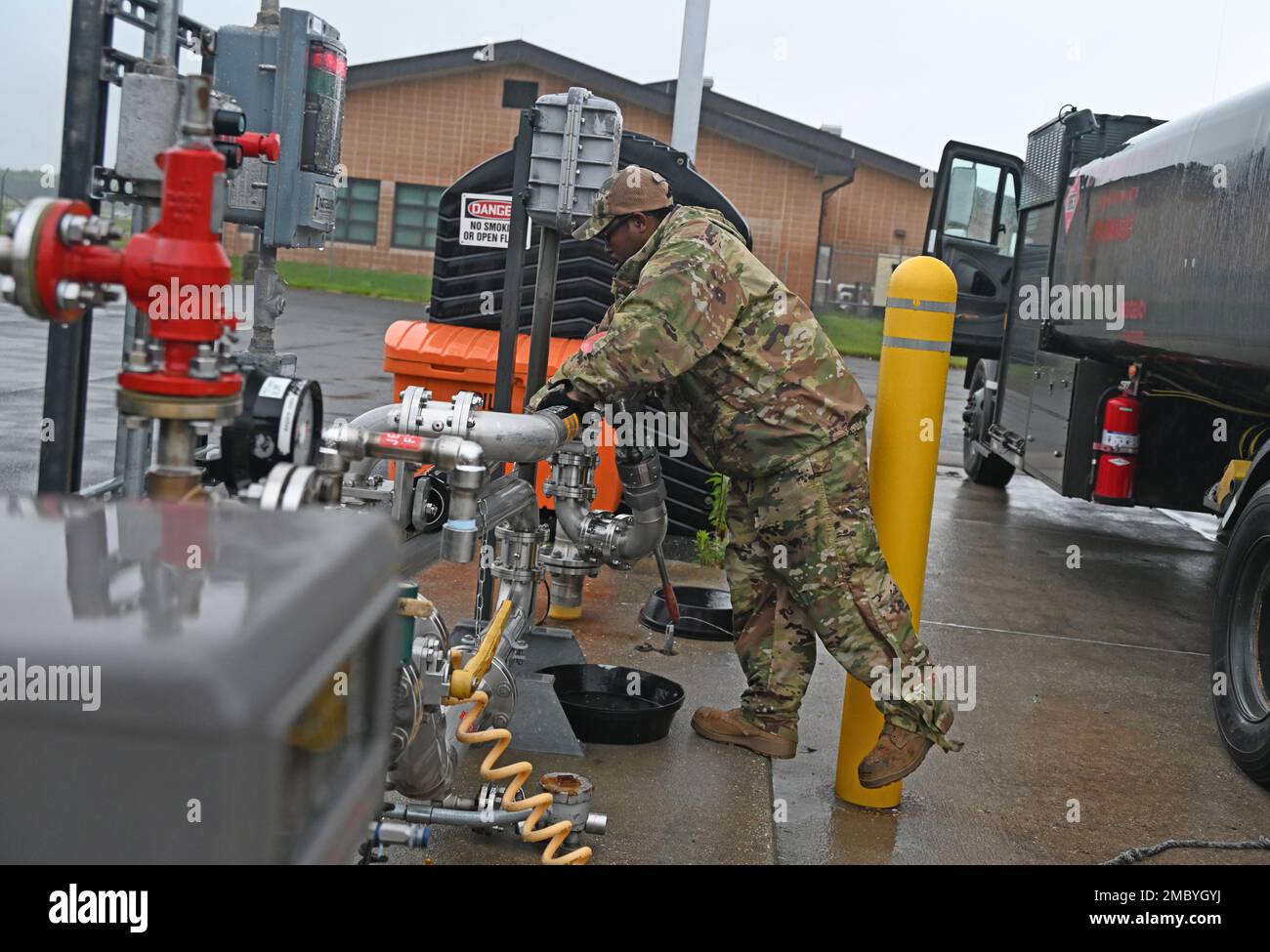 U.S. Air Force Staff Sgt. Terence Bowe, a fuels craftsman assigned to the 175th Mission Support Group, Maryland Air National Guard, puts away equipment after filling up a fuel truck at Warfield Air National Guard Base, Middle River, Md., June 23, 2022. Nearly 1,500 Airmen are assigned to the 175th Wing and serve in a wide range of career fields, like cyber, civil engineering, aircraft maintenance, logistics, intelligence, medical, security, administration, and more. Stock Photo