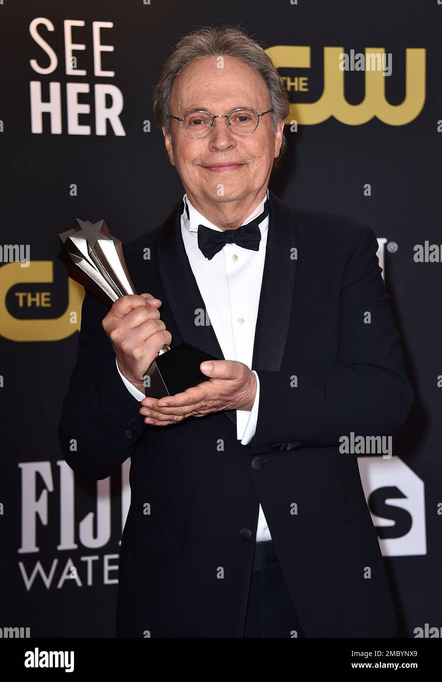 Billy Crystal poses in the press room with his lifetime achievement