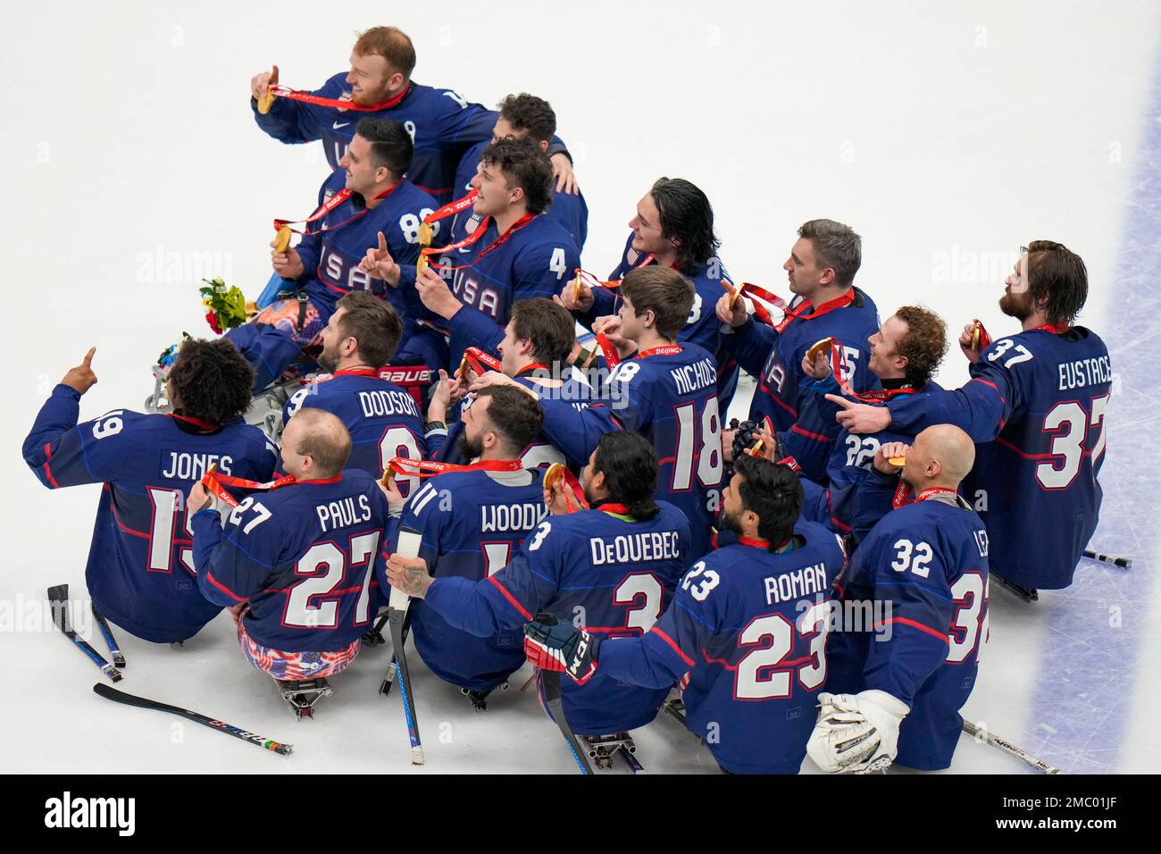 Team USA celebrate with their gold medals after defeating Canada in the